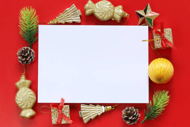 istock Christmas Decoration and empty paper note on red background. 1061358774