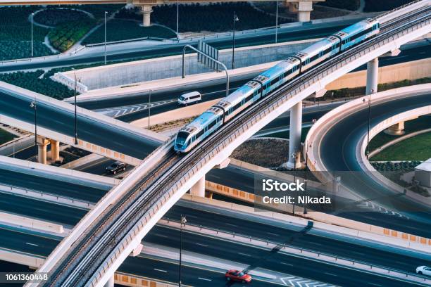 Highway Intersection And Metro Train In Dubai Uae Stock Photo - Download Image Now - Transportation, Train - Vehicle, Built Structure
