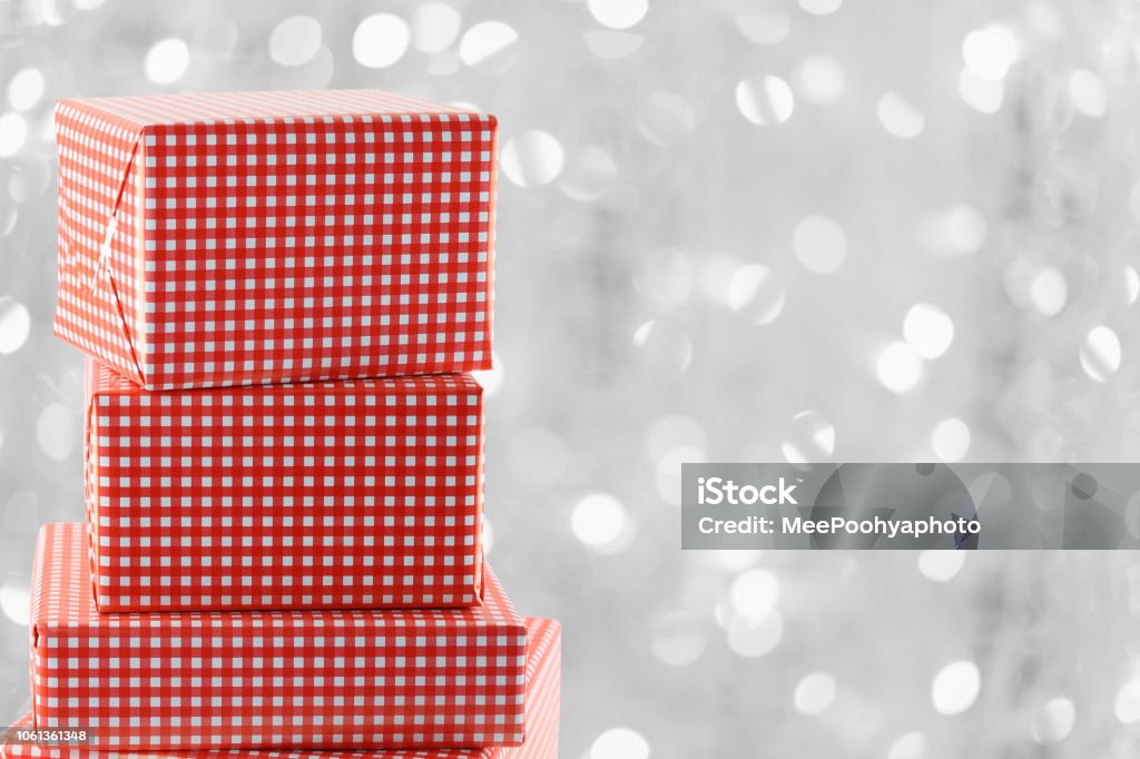 Abstract Red Gift Box Red Gift Box On Silver Bokeh Backdrop Stock Photo - Download Image Now ...