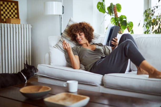 istock Enjoying a digital tablet in the living room. 1061363342