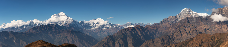 A panoramic view from Khopra of Dhaulagiri I in the Nepal Himalayas on a clear sunny day.