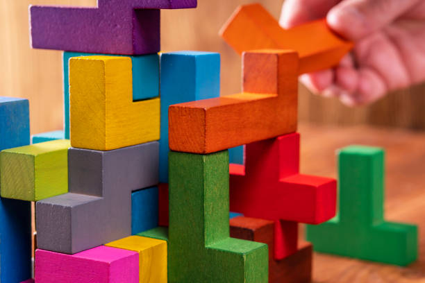 istock Concept of decision making process, logical thinking.  Hand holding wooden puzzle element. 1061367618