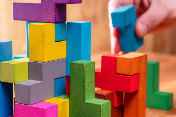 istock Concept of decision making process, logical thinking.  Hand holding wooden puzzle element. 1061367636