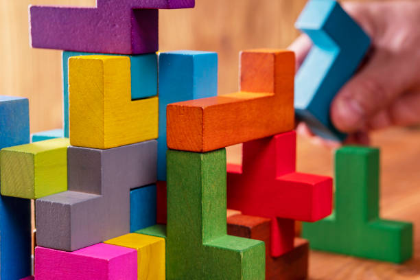 istock Concept of decision making process, logical thinking.  Hand holding wooden puzzle element. 1061367660