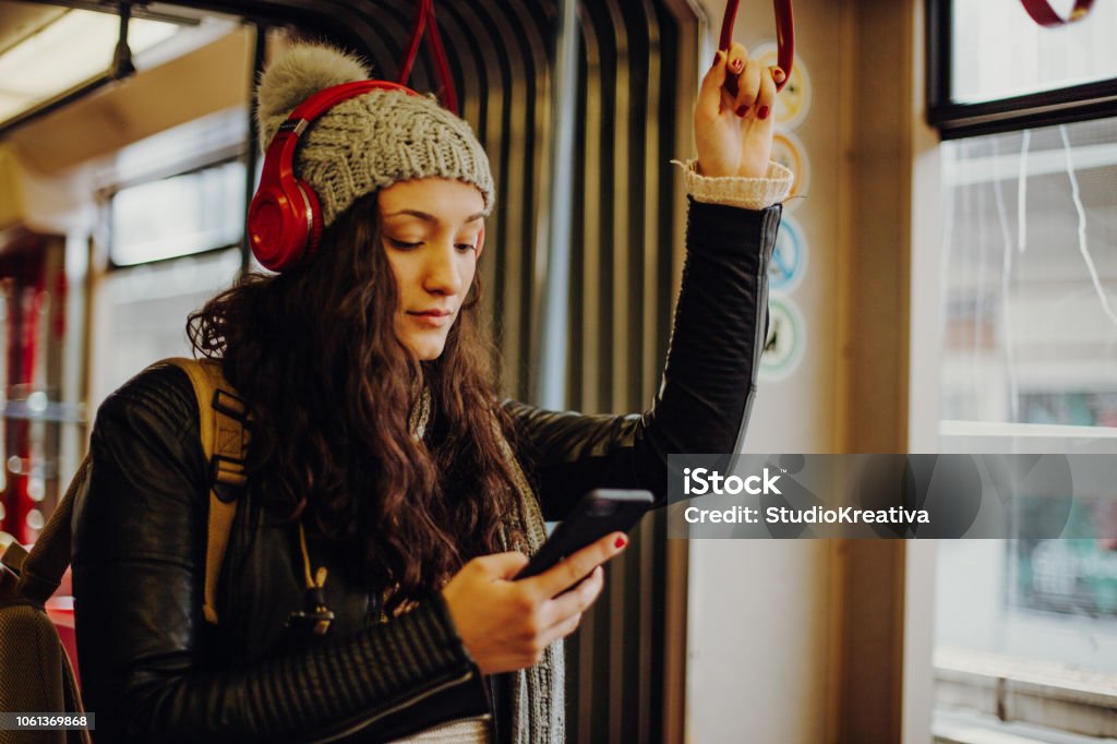 Young woman in public transport Young woman on public transport Adult Stock Photo