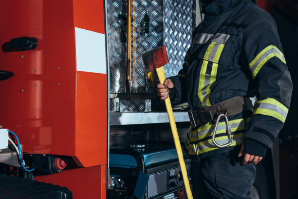 istock partial view of firefighter in fireproof uniform holding axe at fire department 1061369974