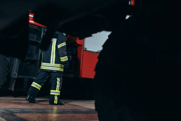 istock partial view of firefighter in protective fireproof uniform walking at fire station 1061370012