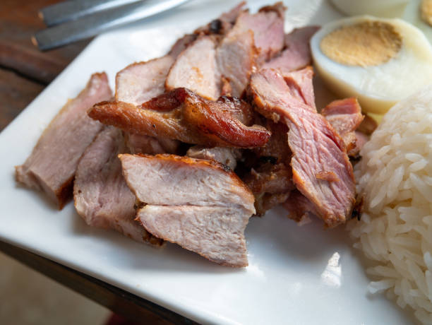 istock Grilled pork, boiled egg and salad with steamed jasmine rice 1061373670