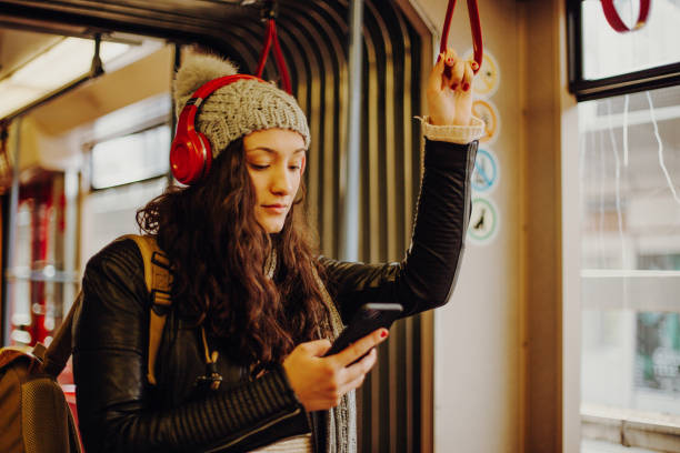Young woman in public transport stock photo