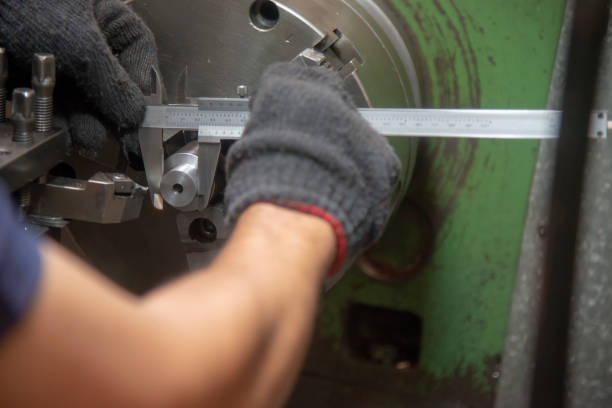 istock The operator use the vernier caliper measure the part on lathe machine. 1061373832