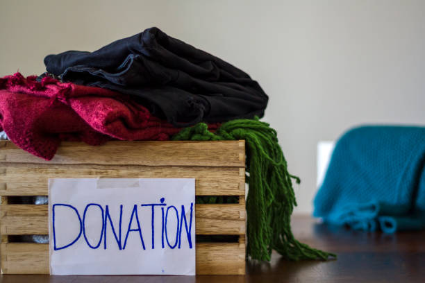 istock Clothes in box for concept donation 1061374626