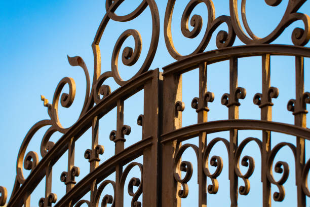 wrought-iron gates, ornamental forging, forged elements close-up - iron gate imagens e fotografias de stock