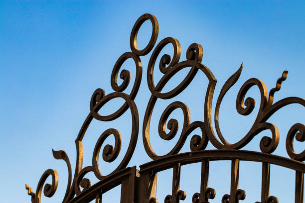 istock wrought-iron gates, ornamental forging, forged elements close-up 1061381154