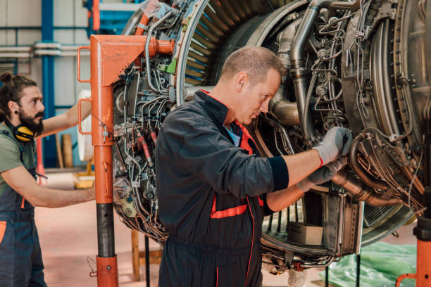 istock Older mechanic repairing aircraft 1061381272