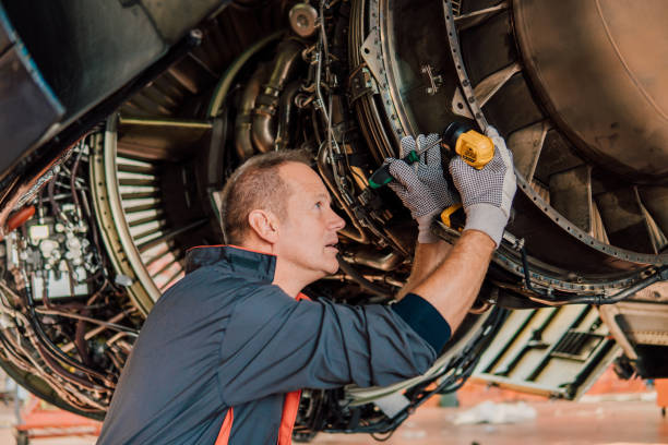 istock Mechanic fixing aircraft 1061381278