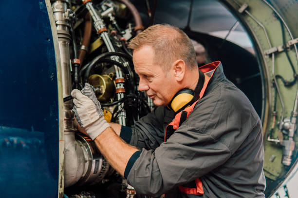 istock Older mechanic repairing aircraft 1061381436