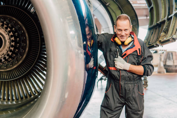 istock Mechanic standing by an aircraft 1061381572
