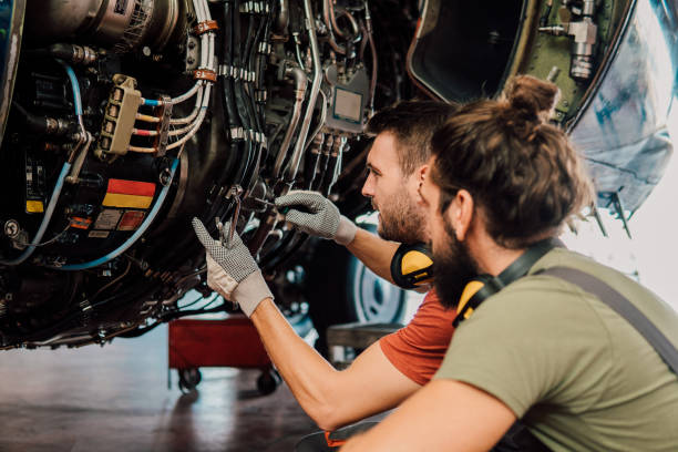 istock Young mechanics repairing aircraft 1061383716