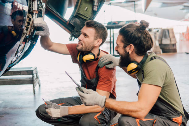 istock Two men repairing an aircraft 1061384786