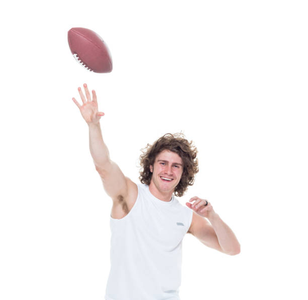 istock Man holding football 1061385024