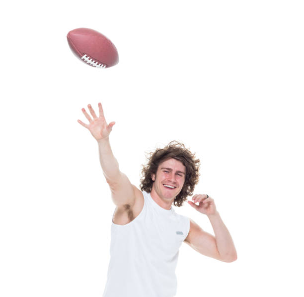 istock Man holding football 1061385854