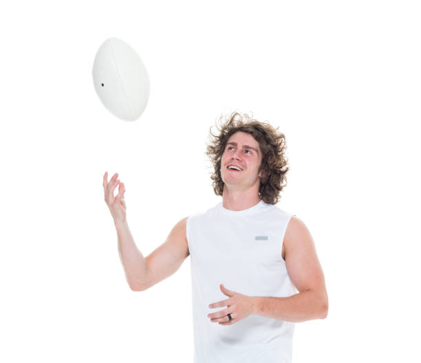 istock Man holding rugby ball 1061385866