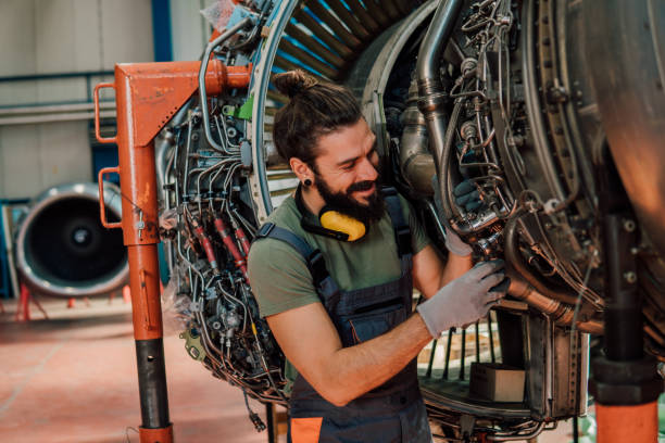 istock Joyful mechanic repairing aircraft 1061386296