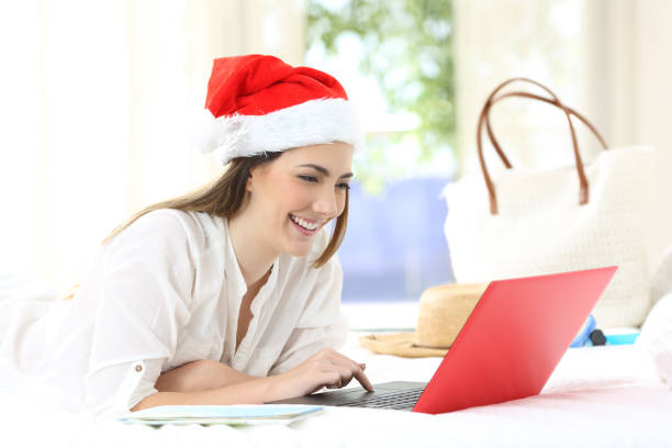 istock Happy girl using a laptop on chritmas holidays 1061387052