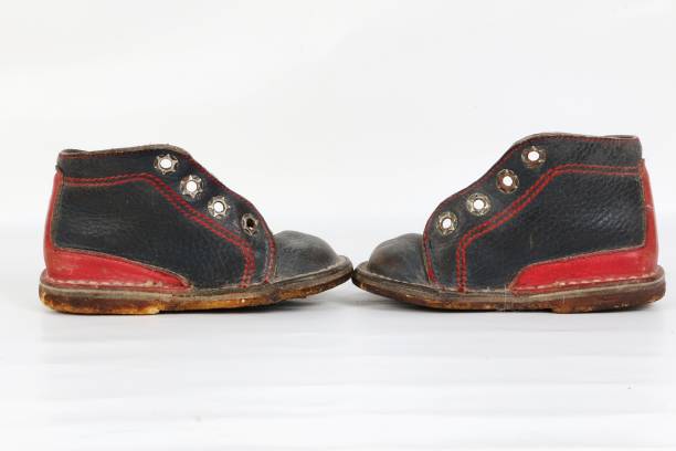 istock pair of old baby shoes 1061388228