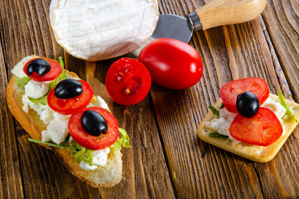 istock Cheese, bruschetta, fruit and honey. Tool for cheese. Wooden table. 1061390858