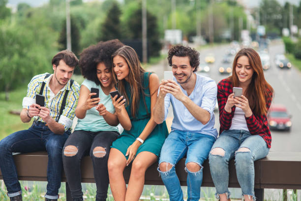 istock Happy friends using smartphones 1061393214