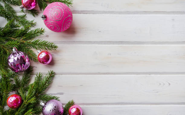 istock Christmas backdrop with decor and fir tree branch over wooden texture. 1061393404
