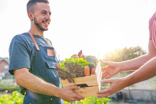 istock Farmer selling his organic produce on a sunny day 1061400876