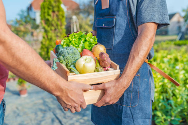 istock Close up view of a farmer and customer 1061401408