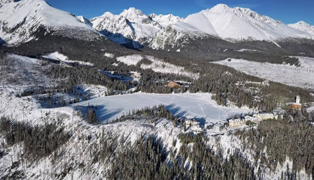 Winter aerial of Strbske Pleso lake resort in High Tatras mountains, Slovakia Aerial view of Strbske Pleso resort, Slovakia pleso stock pictures, royalty-free photos & images