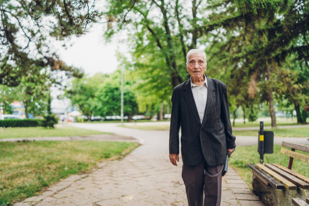 istock Senior man walking in a park 1061405922