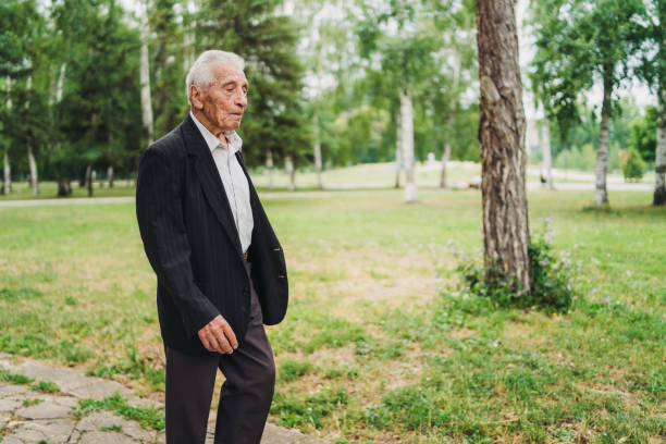 istock Senior man walking in a park 1061406616