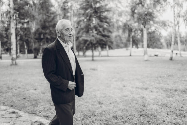 istock Senior man walking in a park 1061406760
