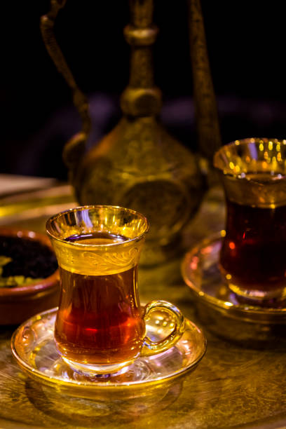 istock Turkish tea - glass and teapot served in traditional style 1061407408