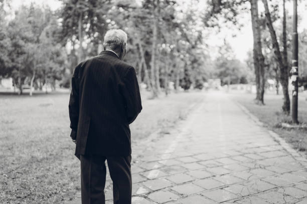 istock Senior man walking in a park 1061407588