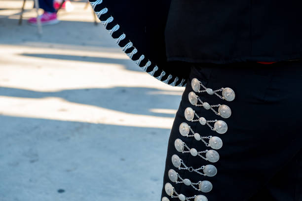 istock Detail of mariachi pants with ornaments while playing on a stage 1061408976