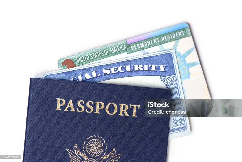 United States passport, social security card and resident card isolated on white background. Immigration concept Civilian Stock Photo