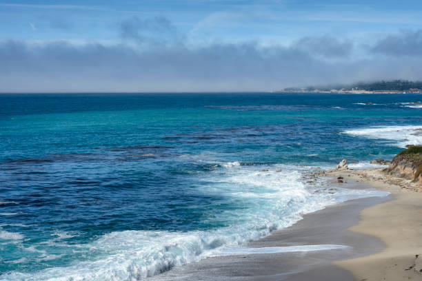 istock Waves Crashing on Carmel River Beach Shore 1061410016