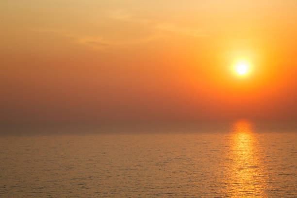 istock horizontal view of Sunset golden light reflecting on sea wave ripple surface background. Abstract, tranquility, serenity, romance, refresh, relaxation, rest, beauty in nature concept. 1061419894