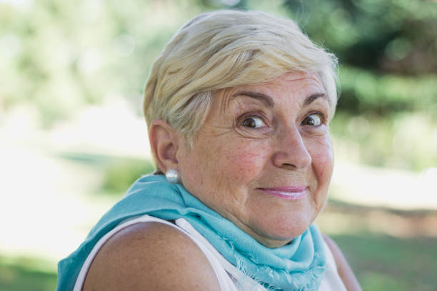 istock Pretty senior woman shrugging her shoulders 1061420370