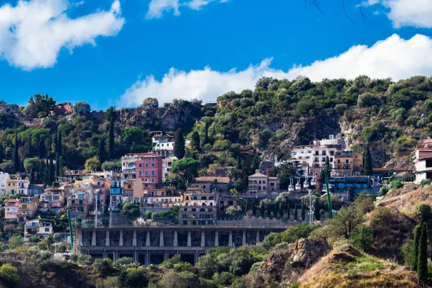 Photo of View from Letojanni to Taormina. Letojanni nestled to the north of Taormina, Letojanni is a popular coastal resort. Sicily, Italy.