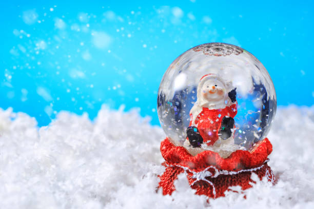 istock Christmas snow globe on snow,Useful as Christmas background card 1061426798