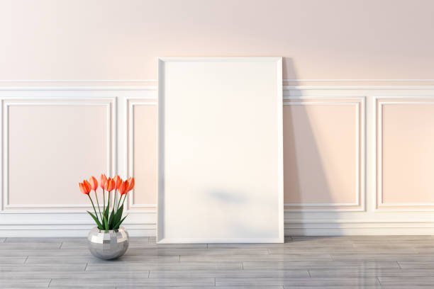 istock Frame poster, empty picture on wooden floor with flowers 1061427150