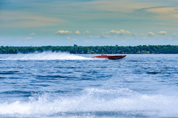 The speedboat galloped and tilted its bow, leaving behind waves