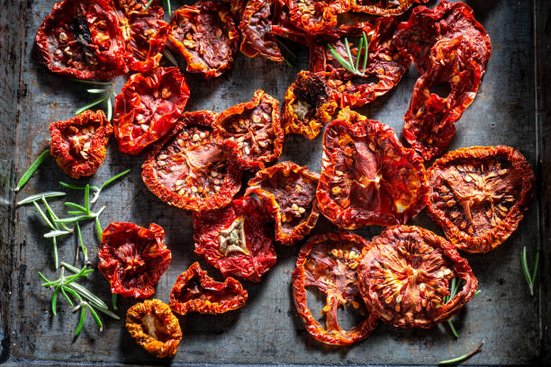 istock Delicious tomatoes dried in the sun on baking tray 1061432162